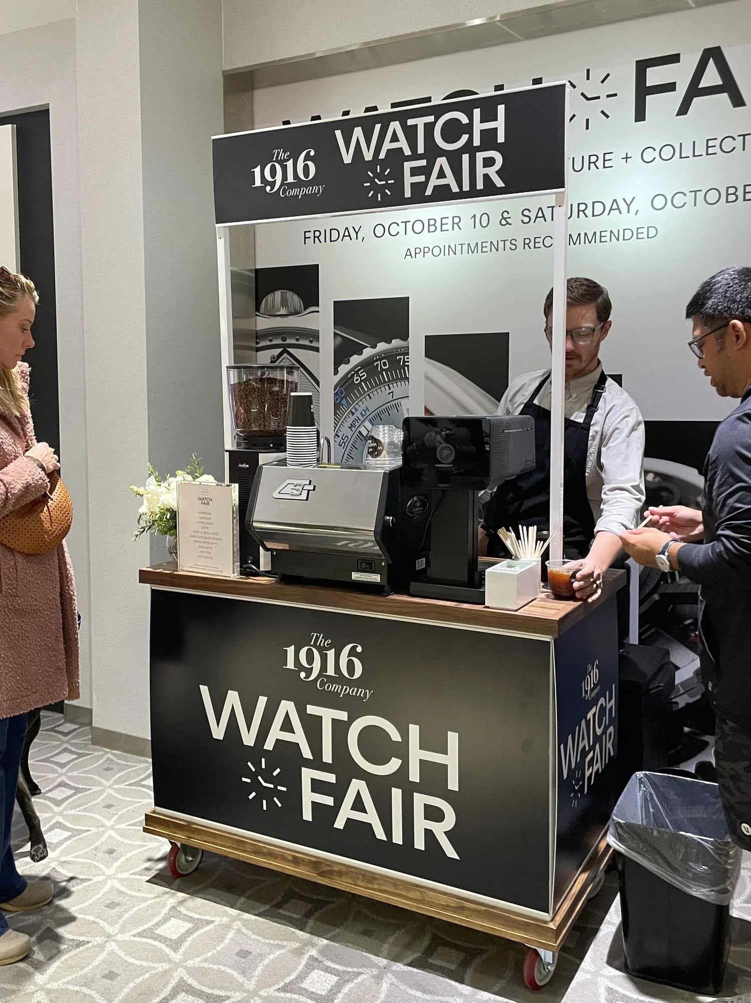 Flipside baristas serving guests from a cart wrapped for The 1916 Company Watch Fair