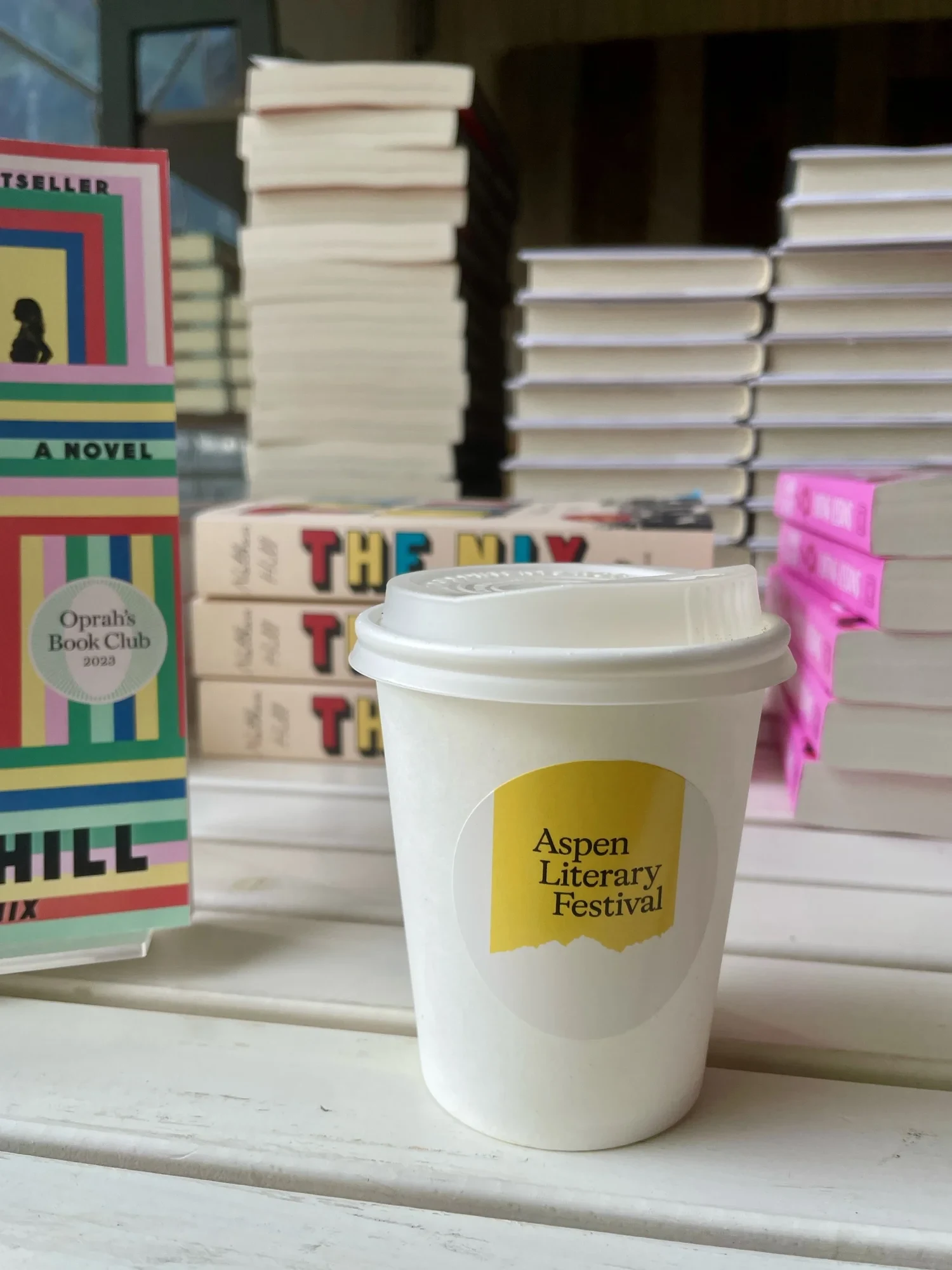 Coffee cup with an Aspen Literary Festival label