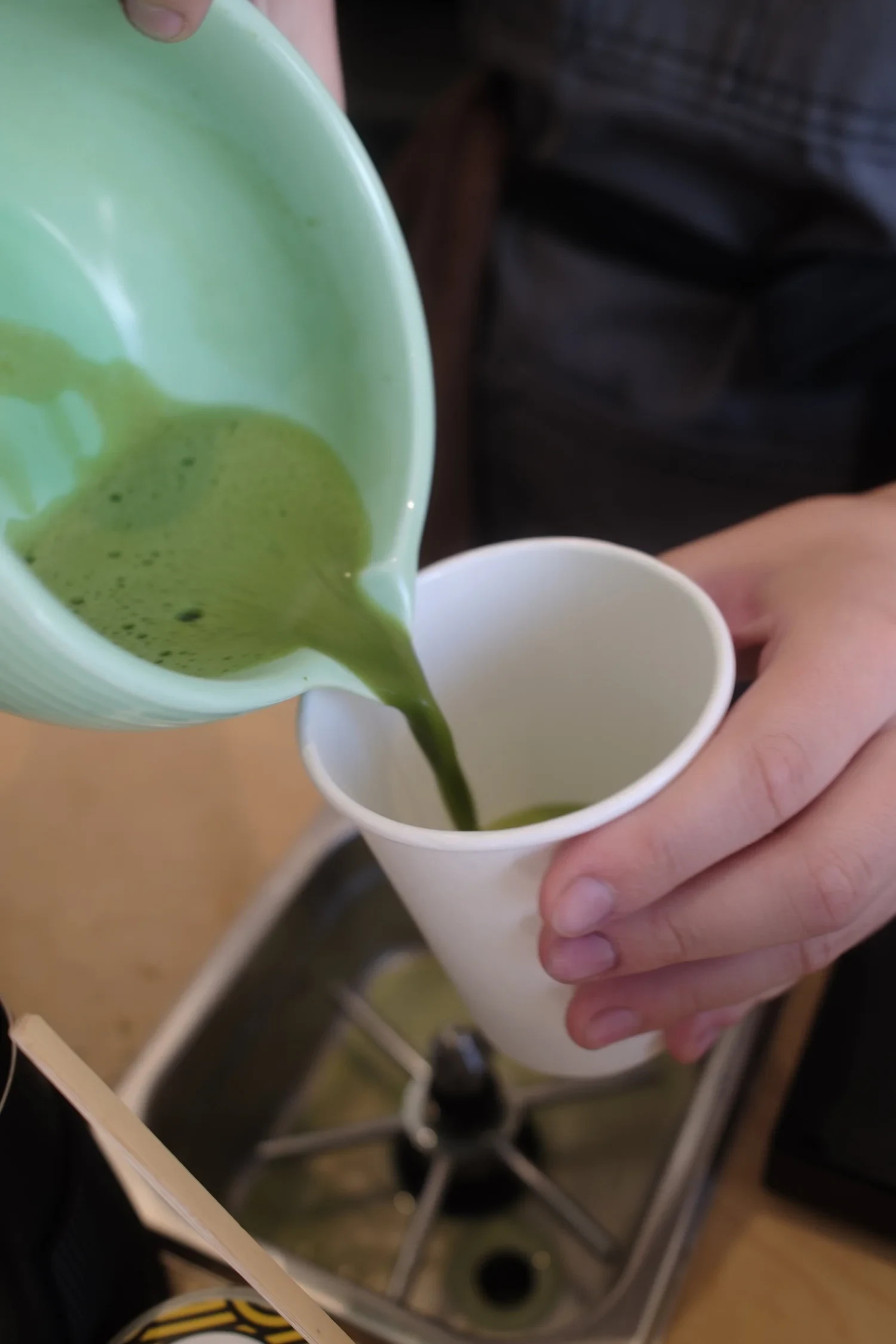 Close-up of ceremonial-grade matcha being poured at a Flipside event