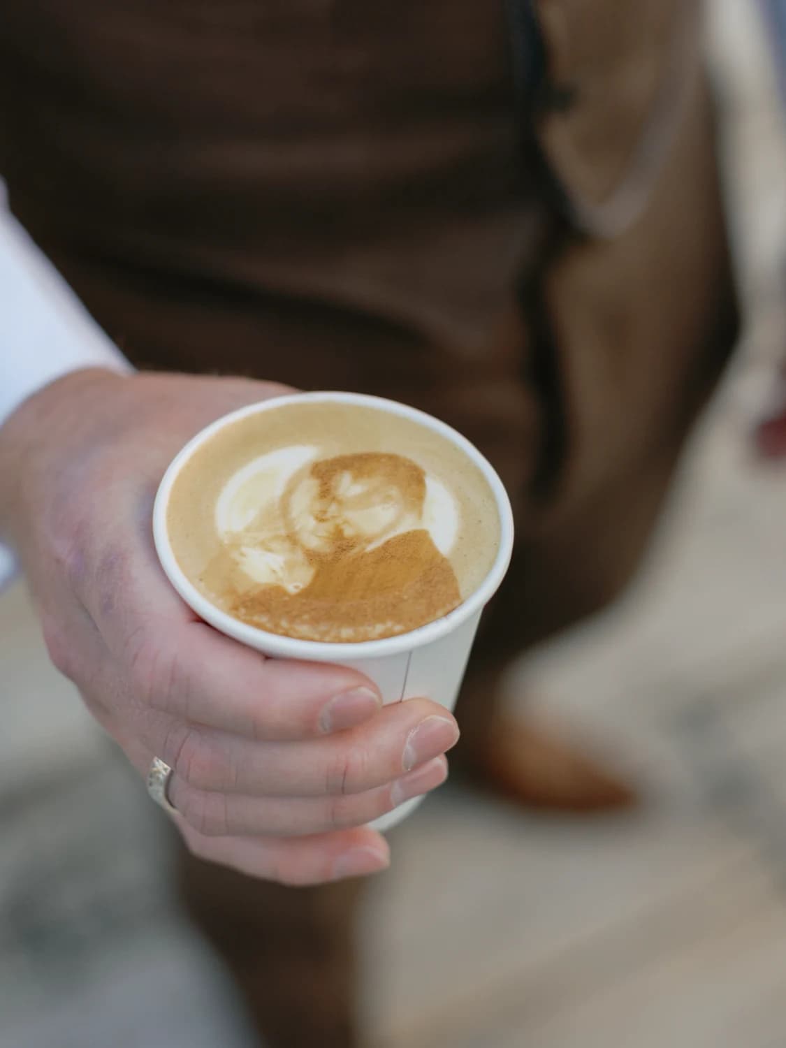 Latte with the couple's photo printed into the foam at a wedding